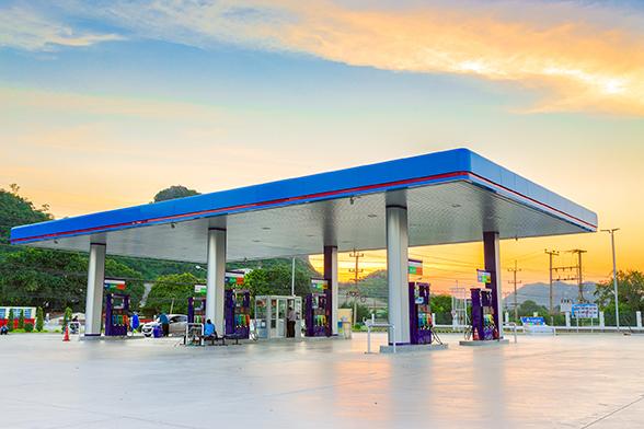 gas station with the sunset behind it